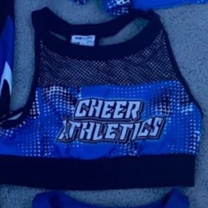 blue top and black shorts